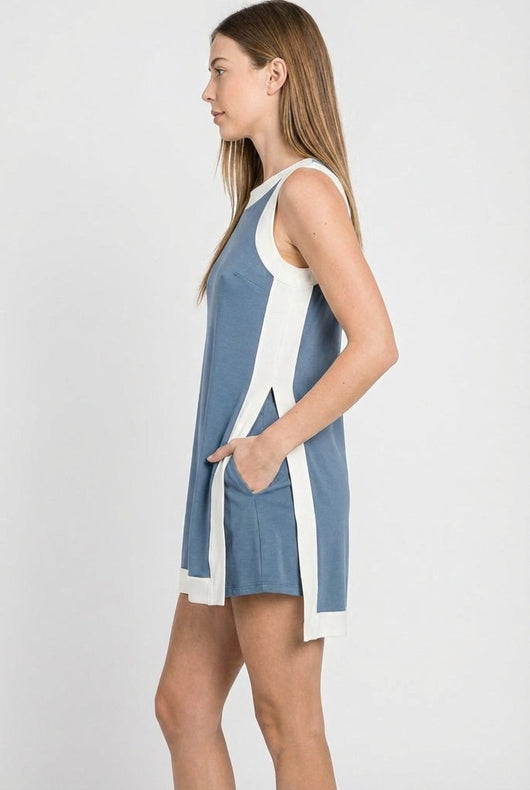 Model wearing the Lohnr Game Day Set in Light Blue, a 100% cotton two-piece outfit featuring hidden shorts with pockets.