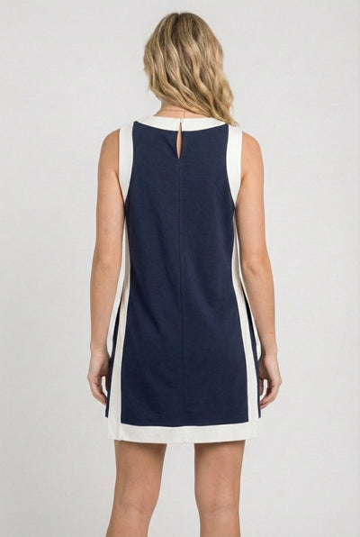 Model wearing the Lohnr Game Day Set in Navy, a 100% cotton two-piece outfit featuring hidden shorts with pockets.