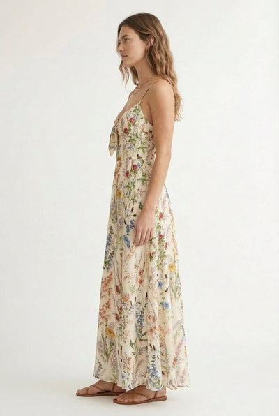 Side profile of the flowy LOHNR Light Birch floral maxi dress